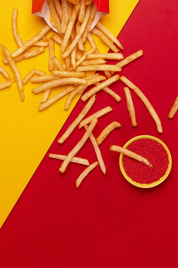 French fries on a red and yellow background